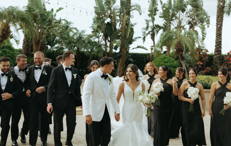 Luxury destination wedding travel details featuring suitcase, passport and vintage camera