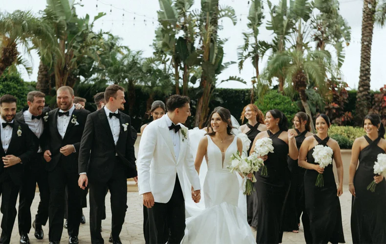 Luxury destination wedding travel details featuring suitcase, passport and vintage camera