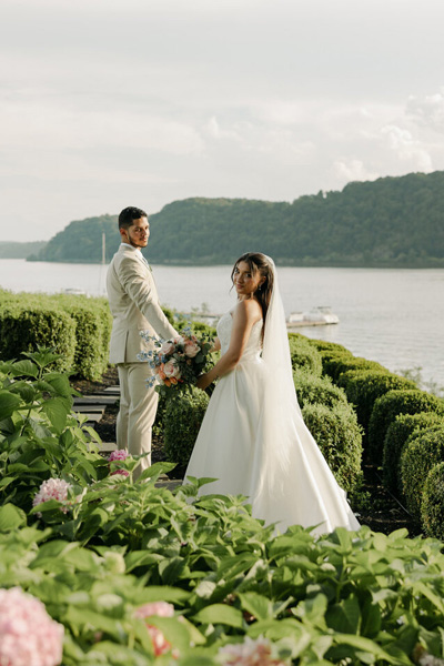 Bride and groom overlooking the ocean during an intimate destination wedding ceremony