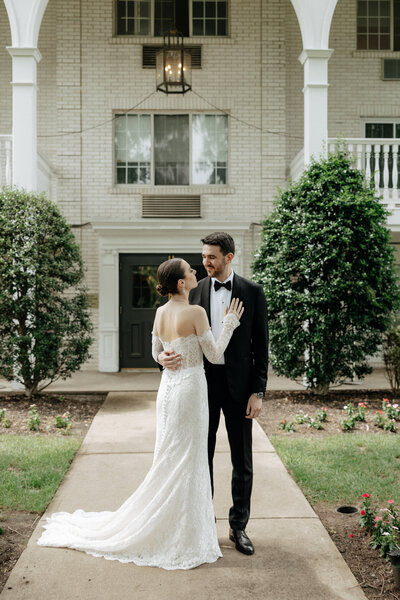 Bride and groom embracing outside the wedding venue after their ceremony