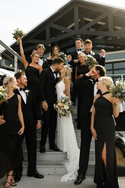Bride and groom celebrating with their wedding party