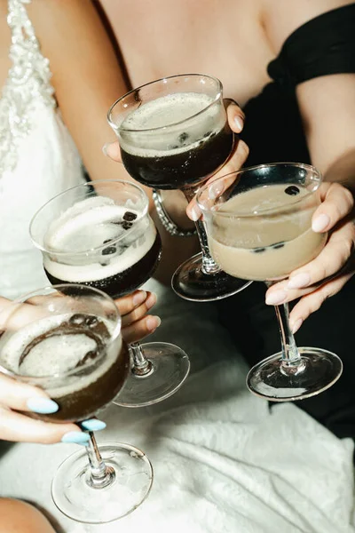 Wedding guests celebrating with espresso martinis during cocktail hour
