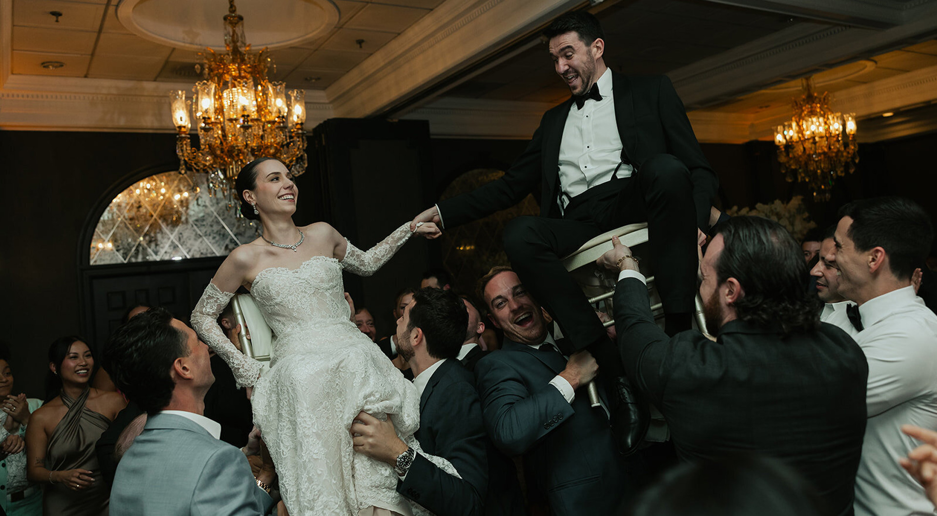 Bride and groom celebrating with their wedding guests