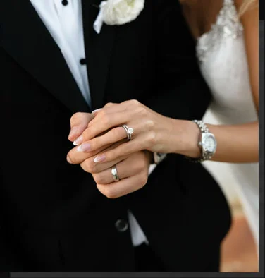 Wedding couple holding hands