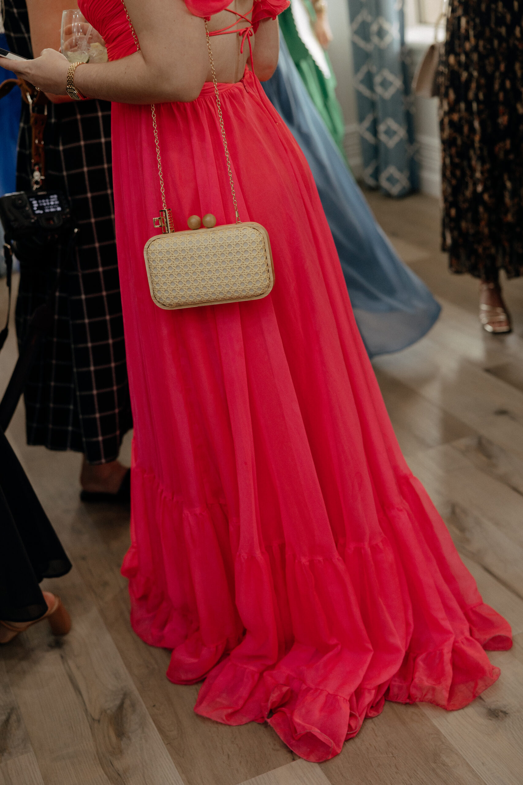 High-fashion wedding guests at The Club at The Strand Naples cocktail hour